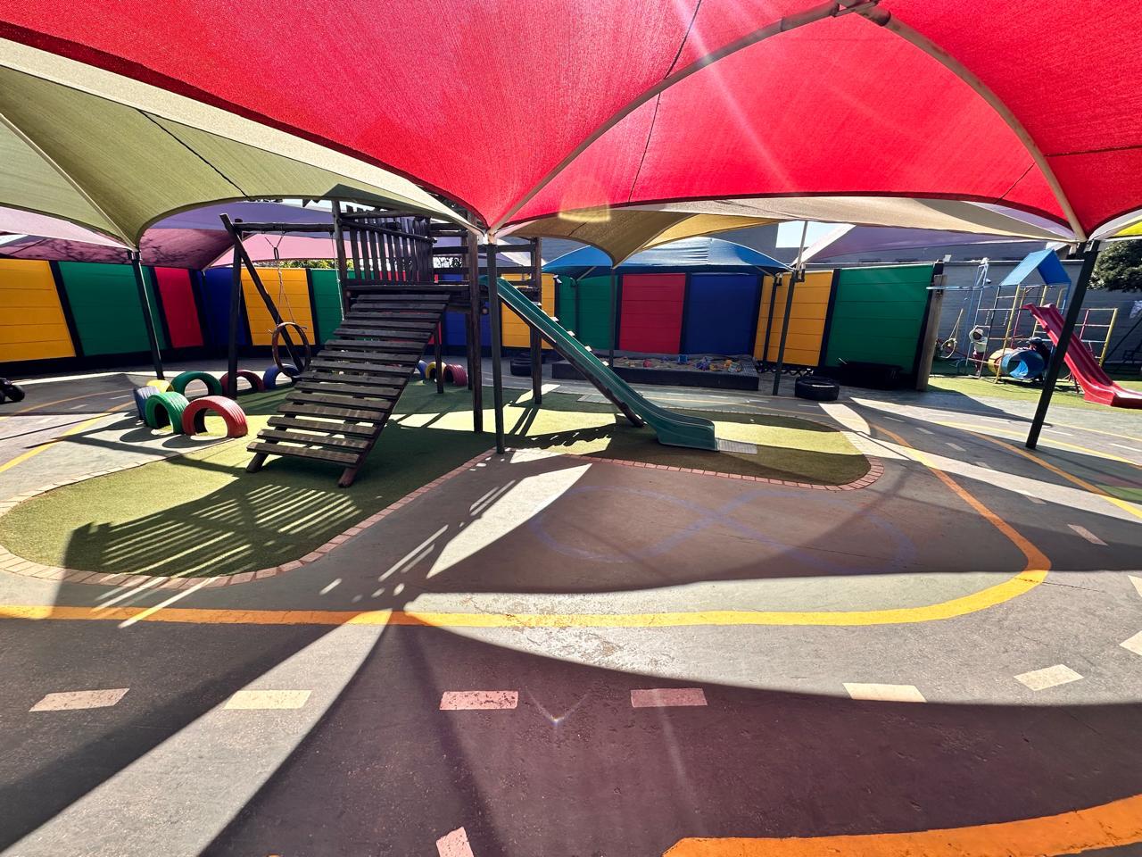 Covered play area beside the classrooms