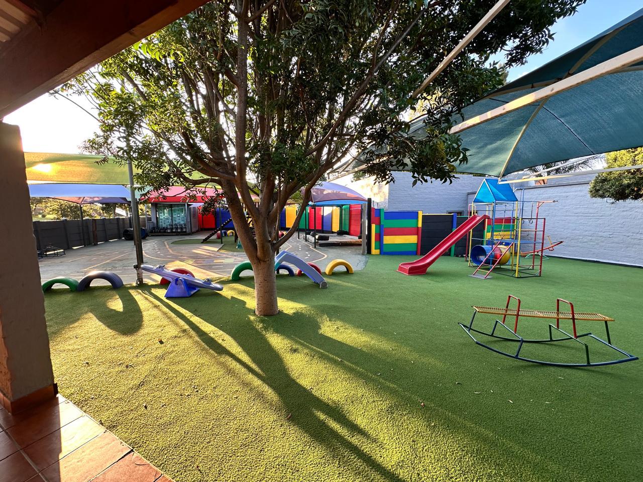 Playground with slide, climbing frame and see-saws